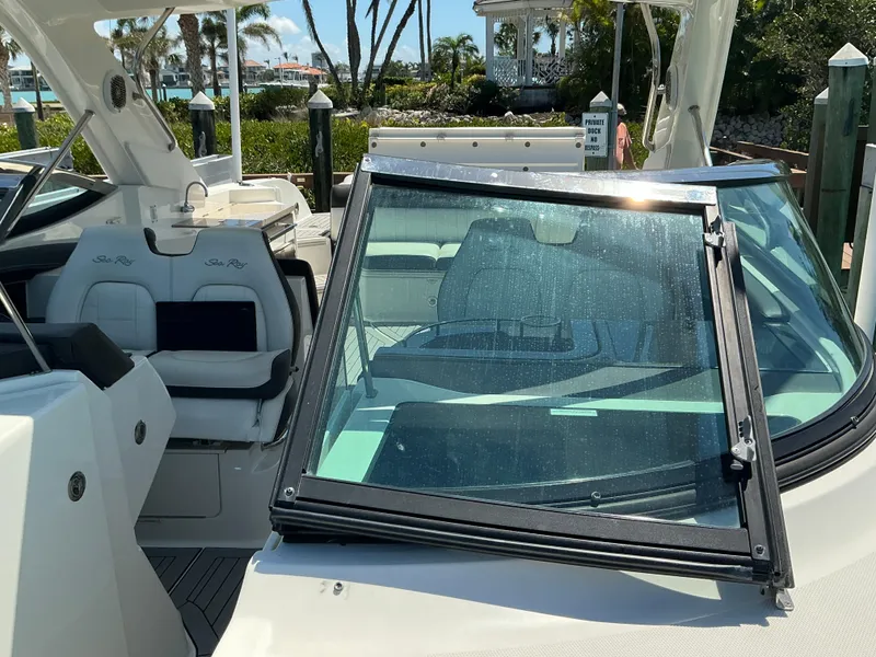 Slide: The Image of 2016 Sea Ray 350 SLX boat with open cockpit and seating area. - 41