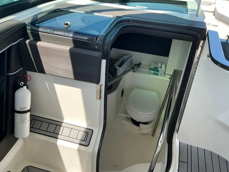 Slide: The Image of Interior view of 2016 Sea Ray 350 SLX boat bathroom with toilet and fire extinguisher. - 42