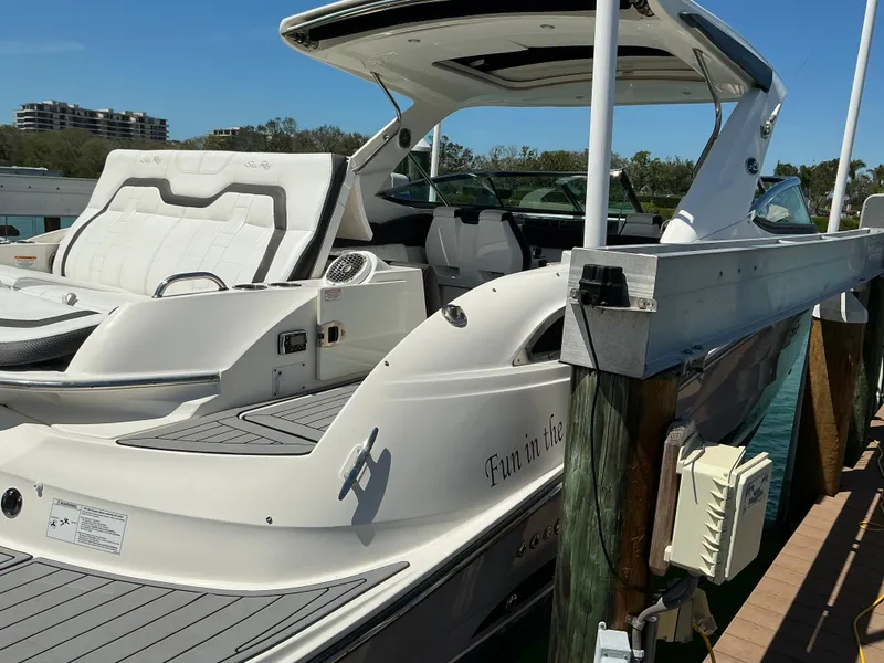 Slide: The Image of 2016 Sea Ray 350 SLX luxury boat docked, featuring sleek design and spacious seating. - 46