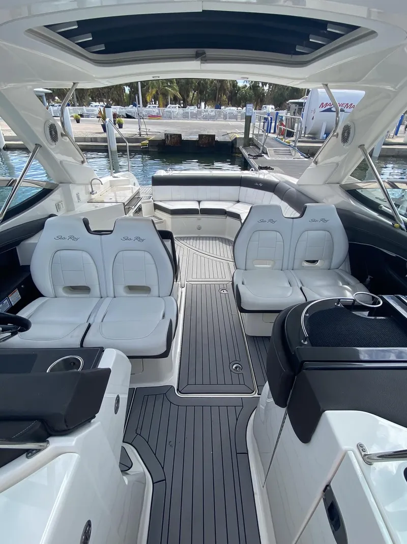 Slide: The Image of 2016 Sea Ray 350 SLX boat interior with luxurious seating and sleek design. - 6