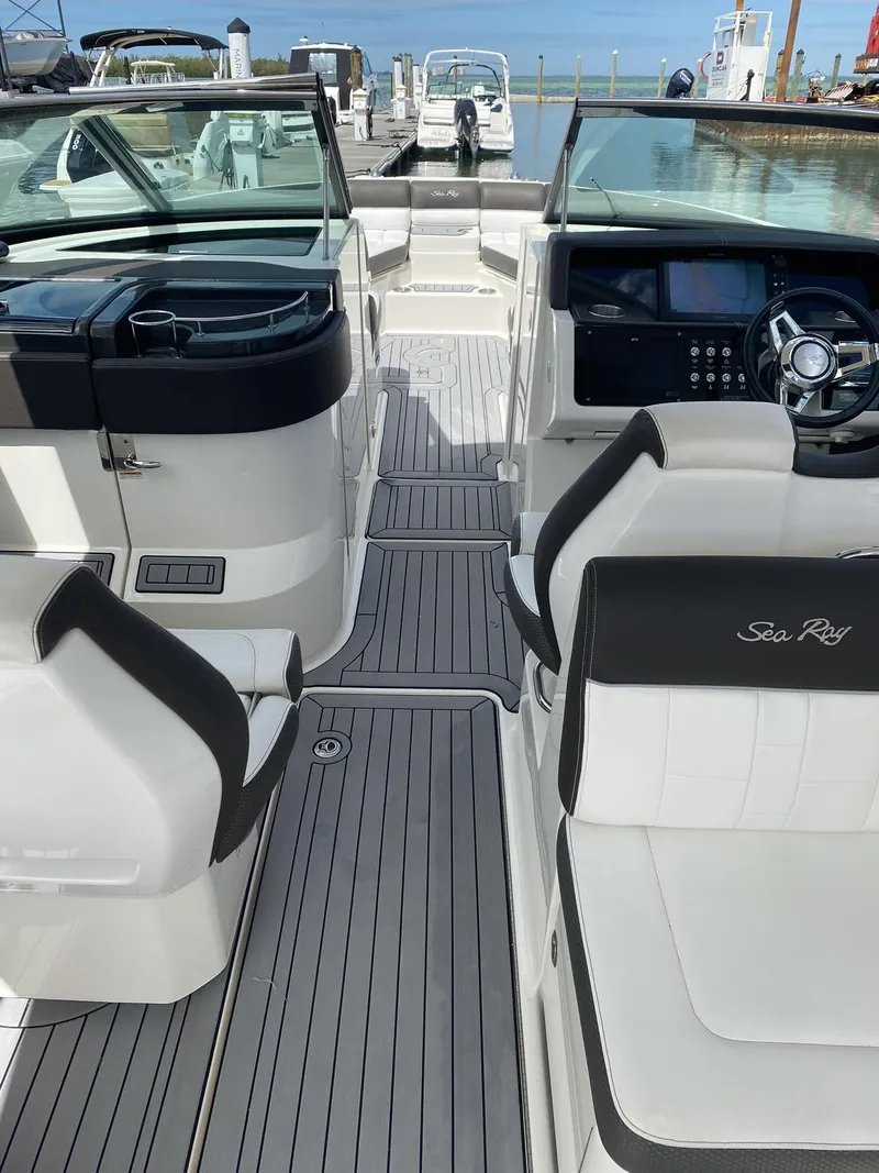 Slide: The Image of 2016 Sea Ray 350 SLX boat interior with sleek seating and modern dashboard. - 8