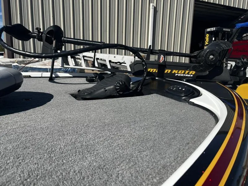 Slide: The Image of Nitro Z9 2011 boat deck with Minn Kota trolling motor in a storage facility. - 5