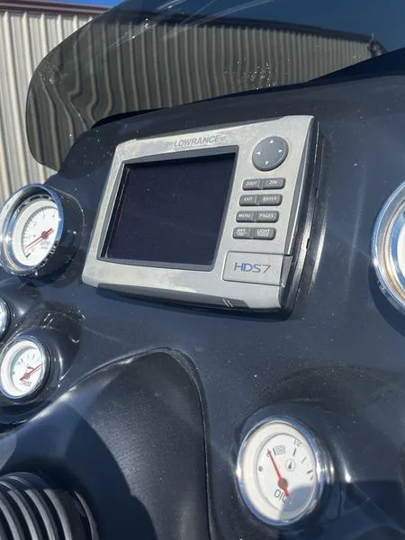 Slide: The Image of 2011 Nitro Z9 dashboard with Lowrance HDS7 and gauges. - 8