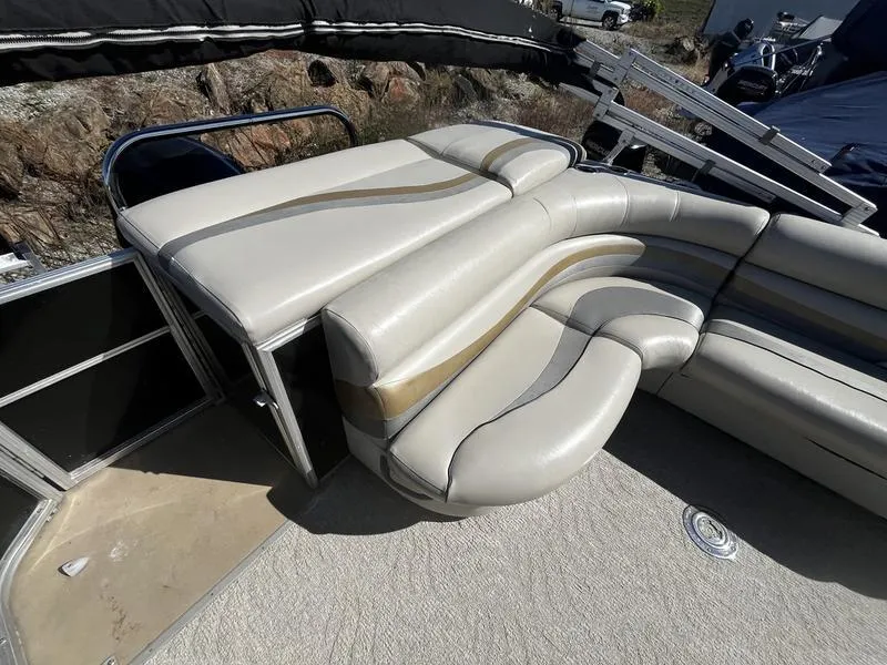 Slide: The Image of 2011 South Bay 522CR pontoon boat with beige and tan seating. - 5