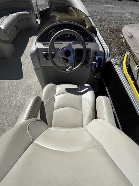 Slide: The Image of 2011 South Bay 522CR boat interior with steering wheel and seating. - 7