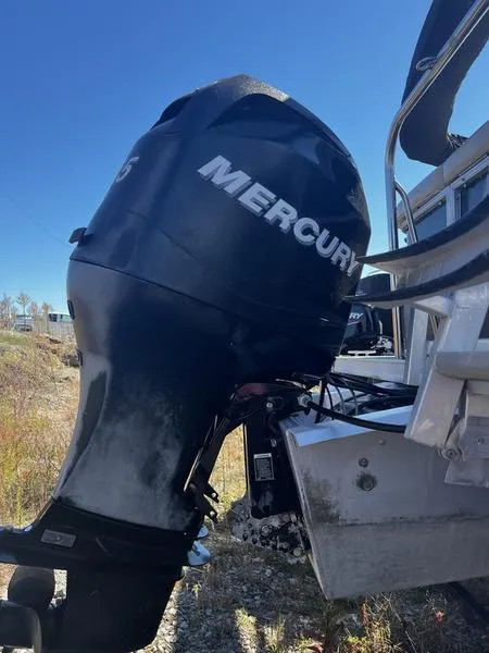 Slide: The Image of 2011 South Bay 522CR with Mercury outboard motor in outdoor setting. - 8