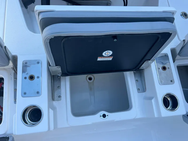 Slide: The Image of 2025 NauticStar 224 Bay boat interior with seating and storage compartments. - 39