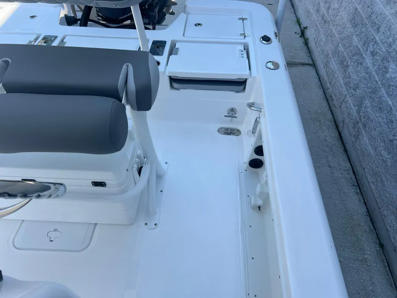 Slide: The Image of 2025 NauticStar 224 Bay boat interior with seating and storage compartments. - 43