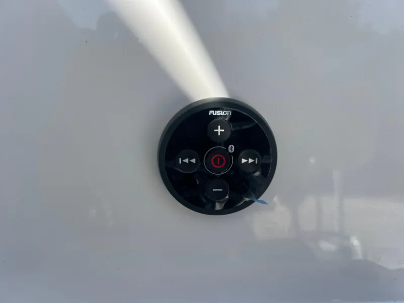 Slide: The Image of Fusion audio control panel on 2025 NauticStar 224 Bay boat. - 46