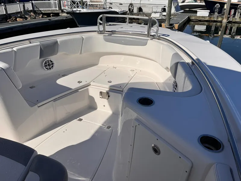 Slide: The Image of 2023 Robalo R302 Center Console boat interior with seating and storage compartments. - 4