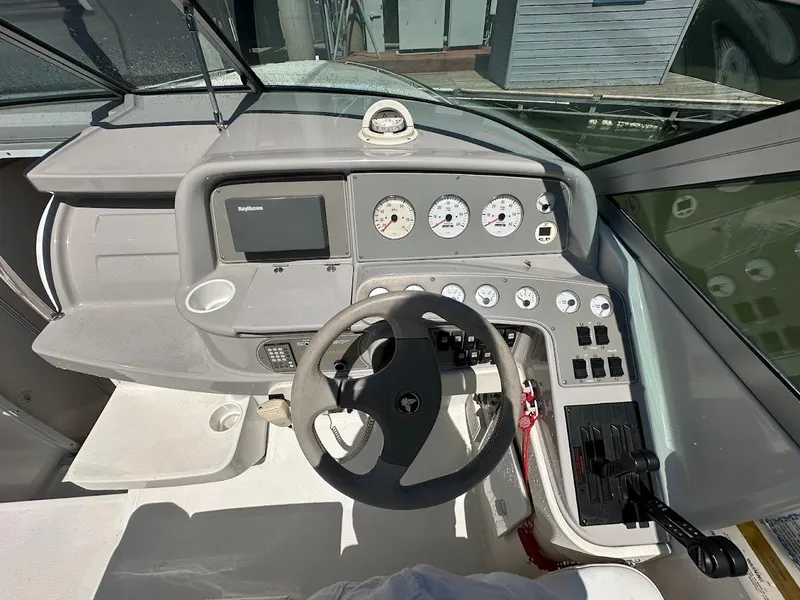 Slide: The Image of Cockpit of 2000 Formula 330 SS boat with steering wheel and control panel. - 15