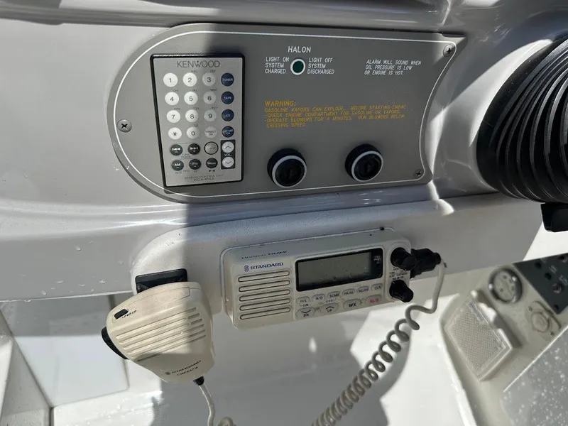 Slide: The Image of Control panel of a 2000 Formula 330 SS boat with radio and Kenwood system. - 18