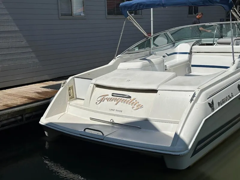 Slide: The Image of 2000 Formula 330 SS boat docked, featuring sleek design and spacious seating. - 36
