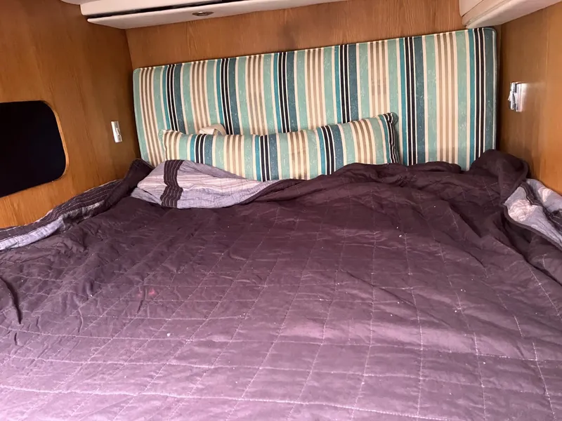 Slide: The Image of Cozy cabin bed with striped headboard in 2010 Broadblue 435 catamaran. - 11