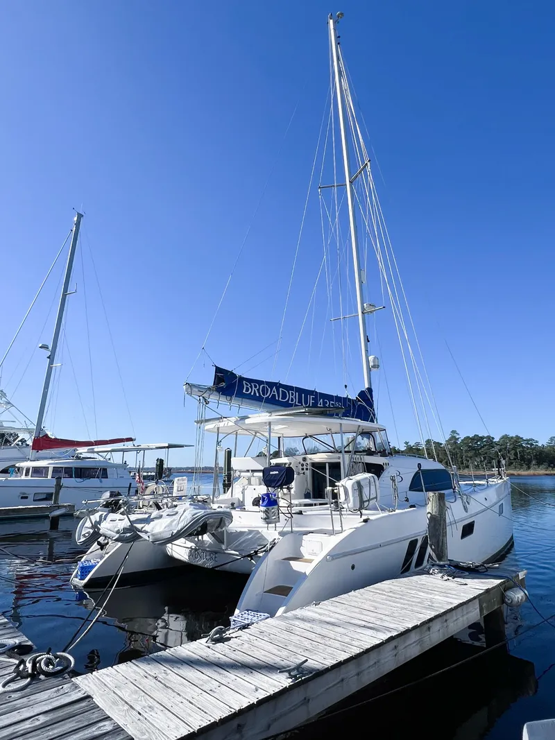 Slide: The Image of 2010 Broadblue 435 catamaran docked at marina under clear blue sky. - 16