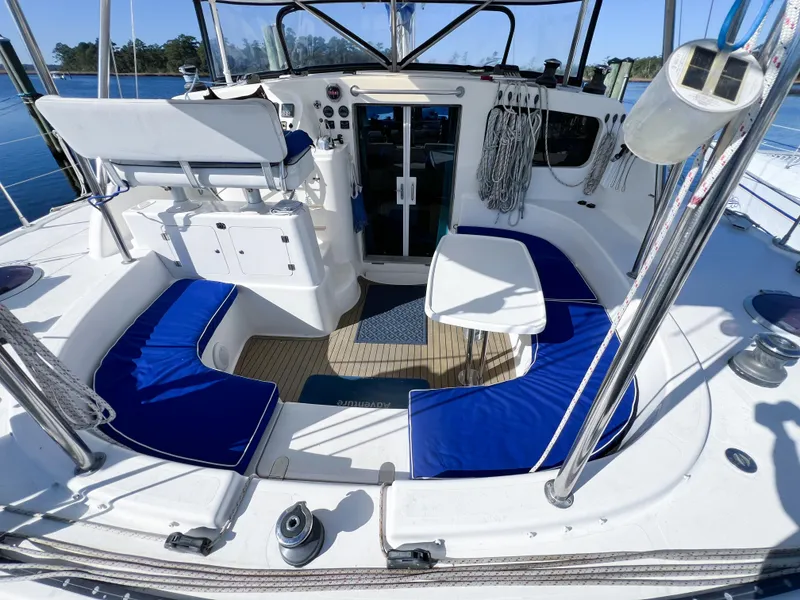 Slide: The Image of Spacious cockpit of 2010 Broadblue 435 catamaran with blue cushioned seating and navigation controls. - 22