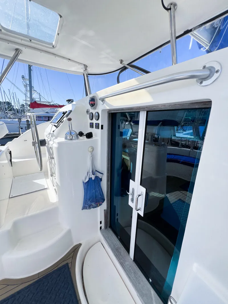Slide: The Image of Broadblue 435 catamaran cockpit with sliding doors and control panel, 2010 model. - 28