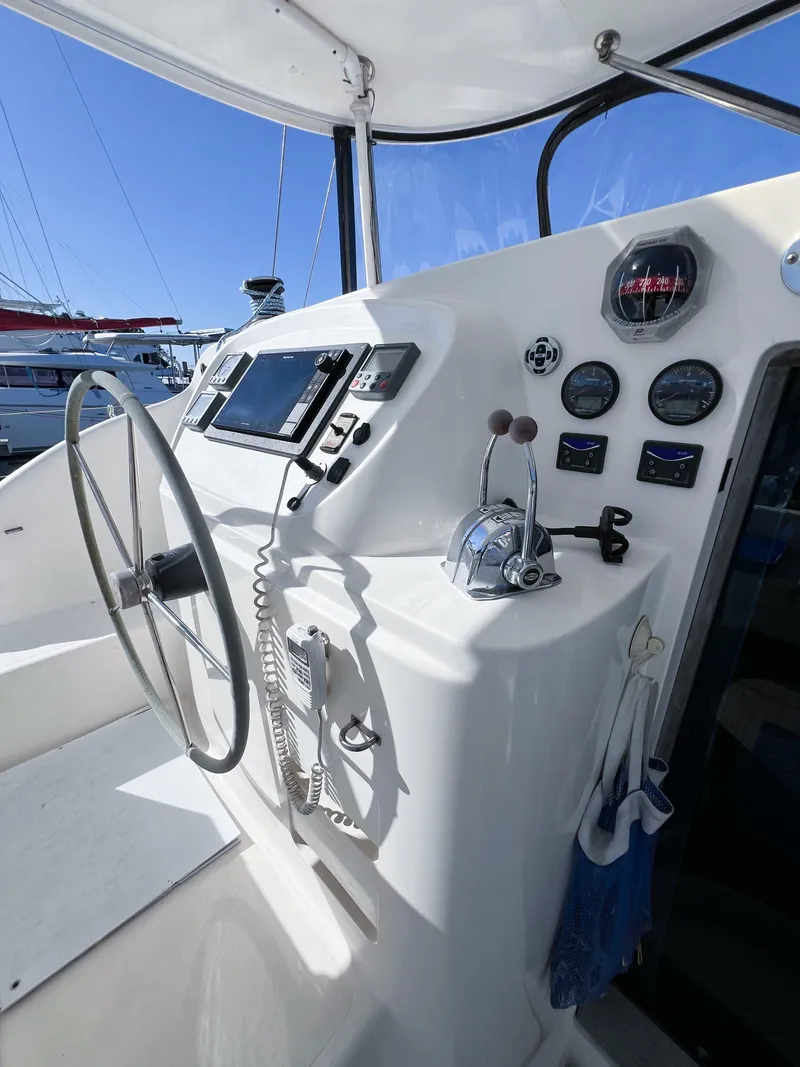 Slide: The Image of Broadblue 435 catamaran helm with navigation instruments and steering wheel, 2010 model. - 29