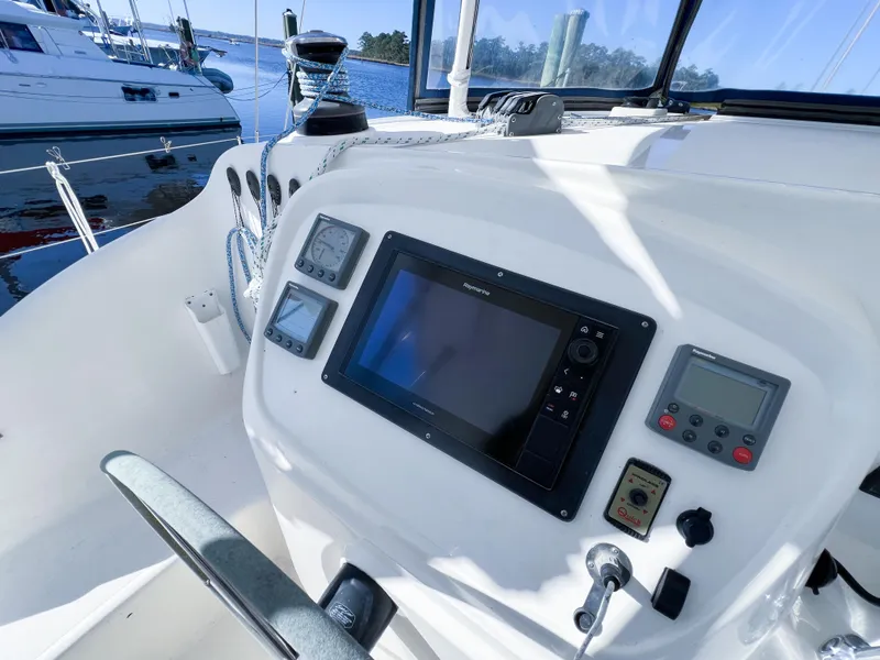 Slide: The Image of Cockpit of 2010 Broadblue 435 catamaran with navigation instruments and steering wheel. - 30