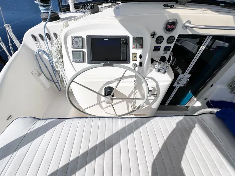 Slide: The Image of Helm of 2010 Broadblue 435 catamaran with steering wheel and navigation instruments. - 32