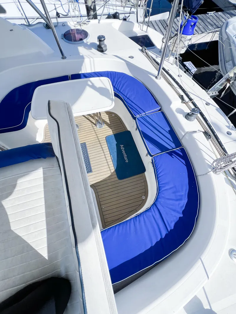 Slide: The Image of Broadblue 435 yacht cockpit with blue cushions, teak flooring, and sleek design, 2010 model. - 36