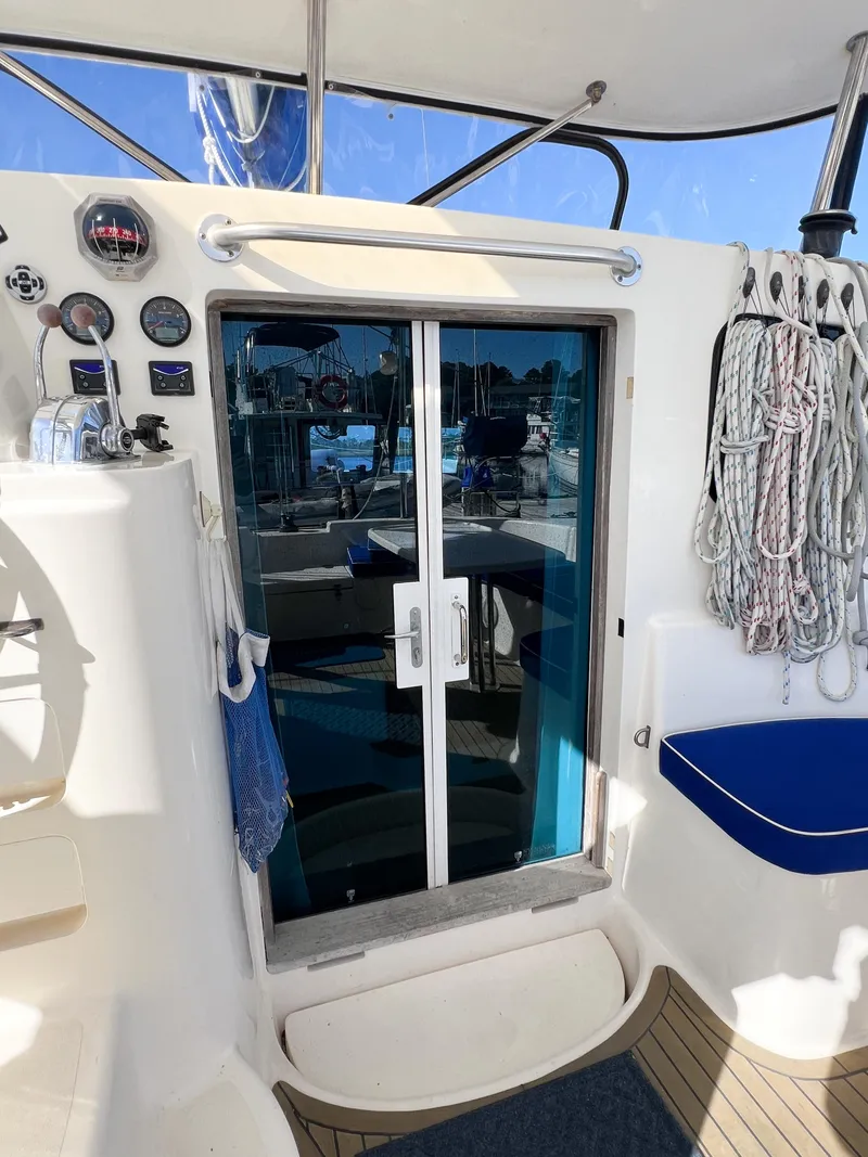 Slide: The Image of Broadblue 435 catamaran cockpit with sliding glass doors and nautical equipment, 2010 model. - 38