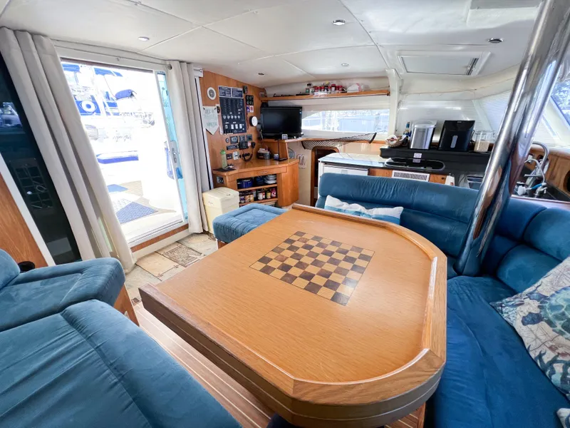 Slide: The Image of Luxurious interior of 2010 Broadblue 435 catamaran with chess table and cozy seating area. - 41