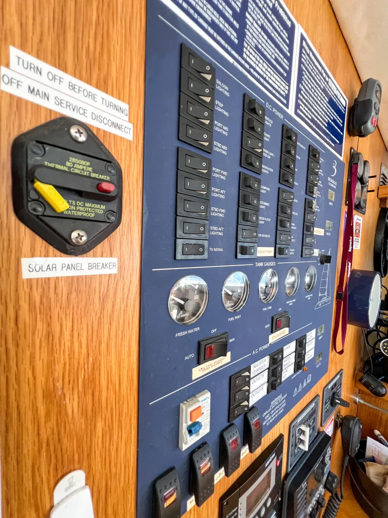Slide: The Image of Control panel of a 2010 Broadblue 435 catamaran with switches and labels. - 46