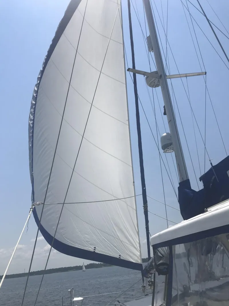 Slide: The Image of Sailing on a 2010 Broadblue 435 catamaran with full sails under a clear blue sky. - 6