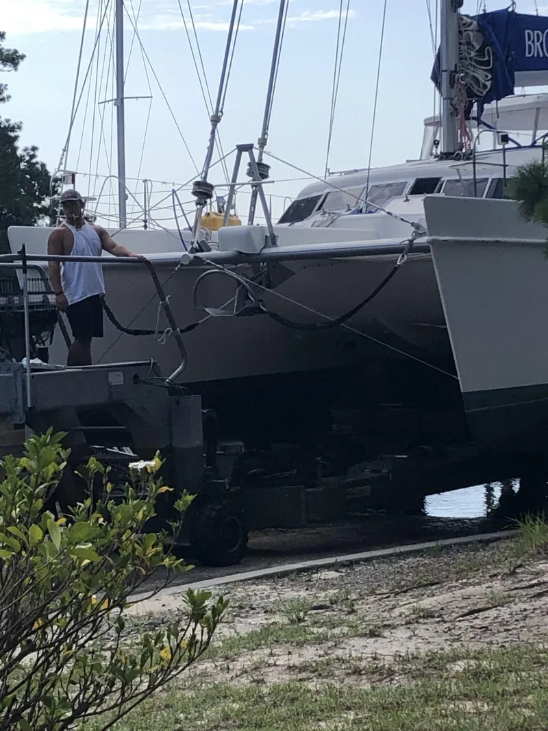 Slide: The Image of 2010 Broadblue 435 catamaran being transported on a trailer near a waterfront. - 7