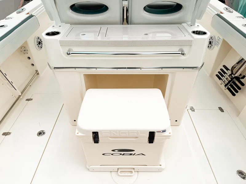 Slide: The Image of 2025 Cobia 285 Center Console boat interior with Engel cooler and seating area. - 12