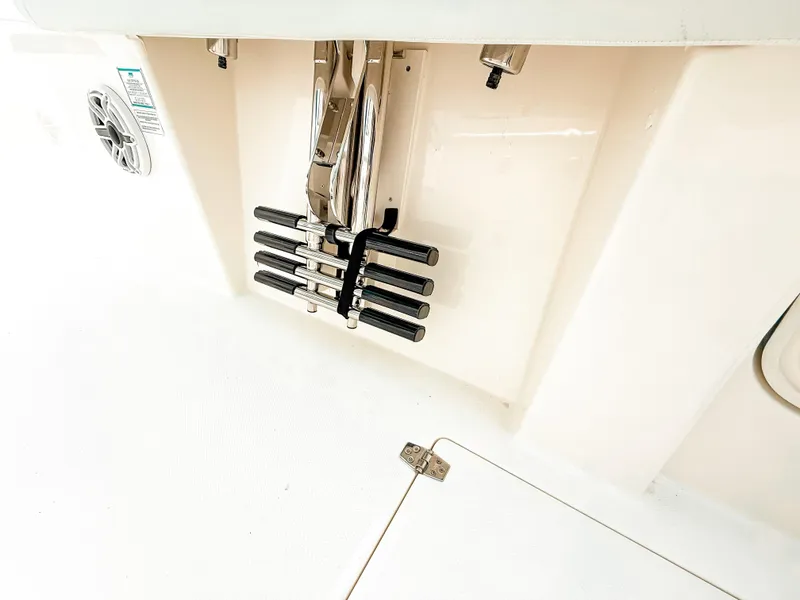 Slide: The Image of 2025 Cobia 285 Center Console boat deck with stainless steel rod holders. - 26