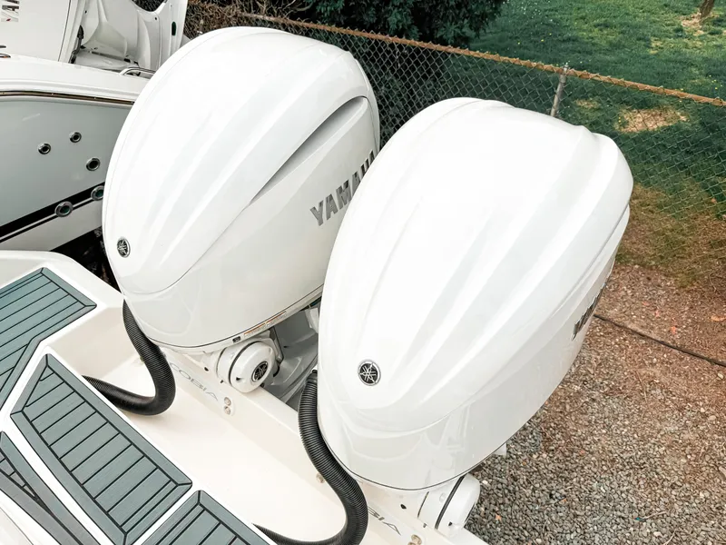 Slide: The Image of 2025 Cobia 285 Center Console with twin Yamaha outboard engines. - 4