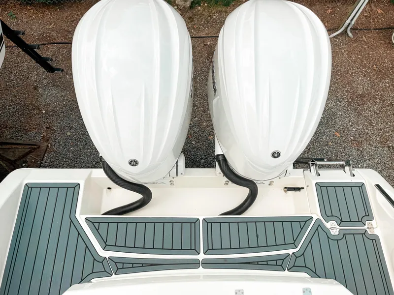 Slide: The Image of 2025 Cobia 285 Center Console with dual outboard engines, top view. - 5