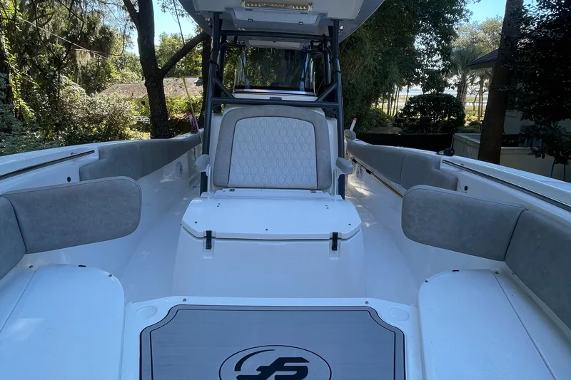 Slide: The Image of 2021 Sea Fox 288 Commander boat interior with cushioned seating and sleek design. - 13