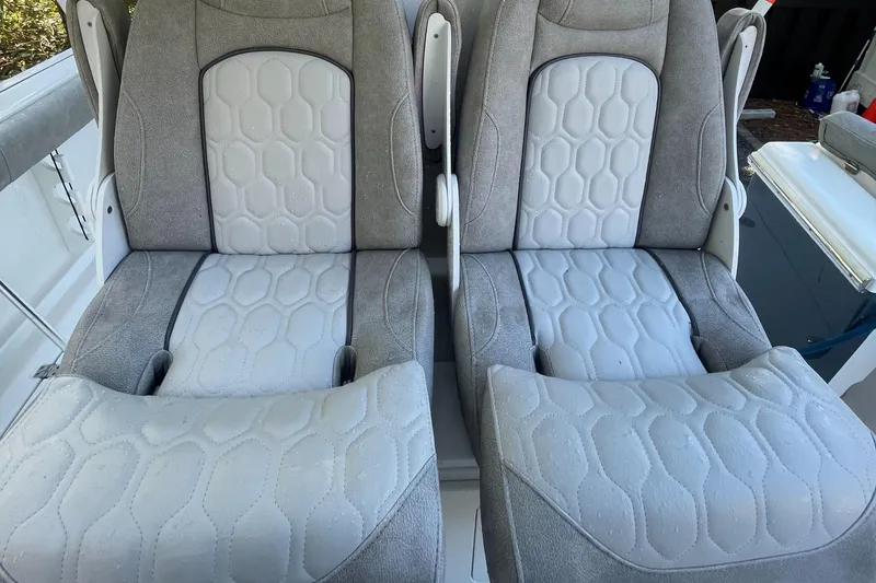 Slide: The Image of 2021 Sea Fox 288 Commander boat seats, featuring gray and white cushioned design. - 18