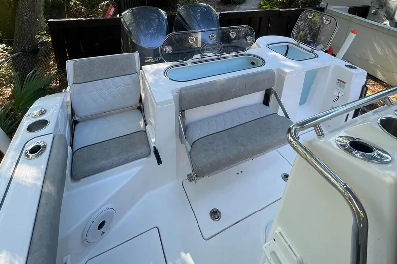 Slide: The Image of 2021 Sea Fox 288 Commander boat interior with cushioned seating and modern design. - 6