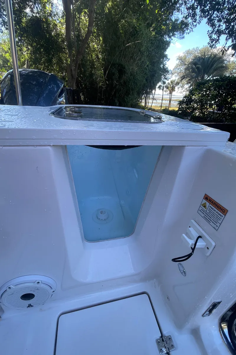 Slide: The Image of 2021 Sea Fox 288 Commander boat interior detail with storage compartment. - 7