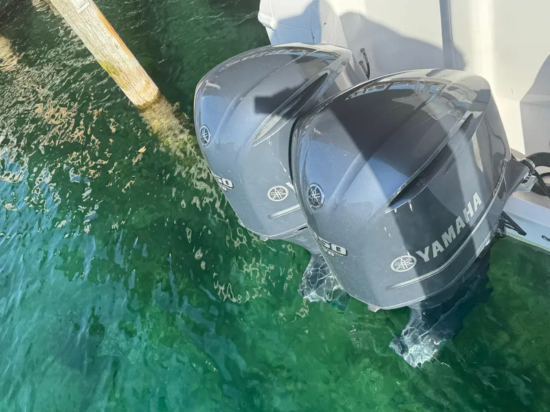 Slide: The Image of Twin Yamaha outboard motors on a 2011 Intrepid 370 Cuddy in clear water. - 10