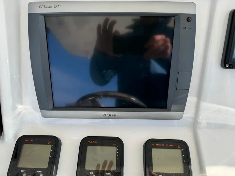 Slide: The Image of Garmin GPS and gauges on 2011 Intrepid 370 Cuddy boat dashboard. - 21