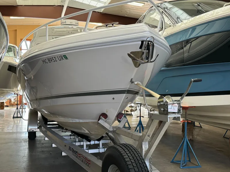 Slide: The Image of 2011 Intrepid 370 Cuddy boat on trailer in showroom. - 26