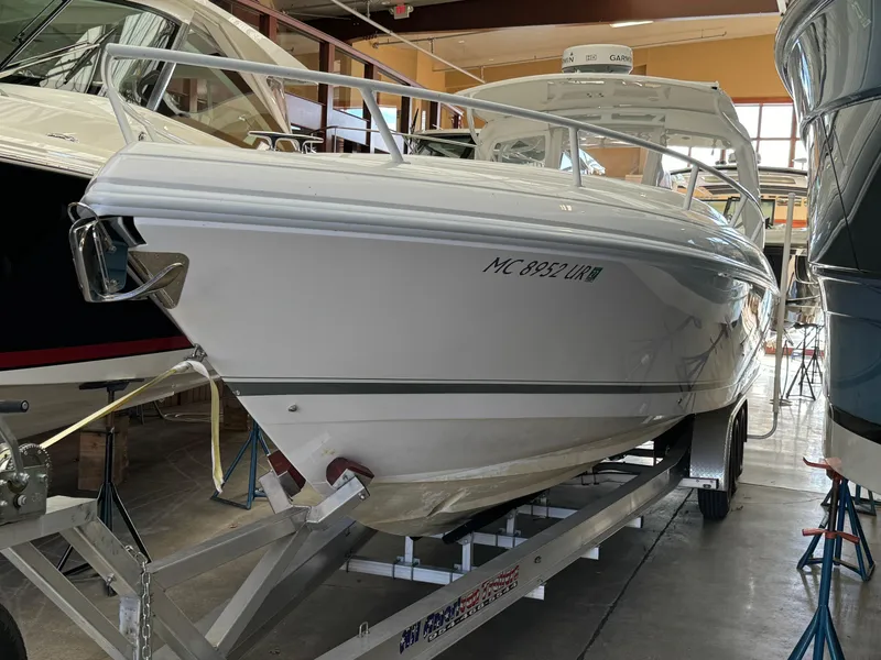 Slide: The Image of 2011 Intrepid 370 Cuddy boat on trailer in indoor storage. - 27