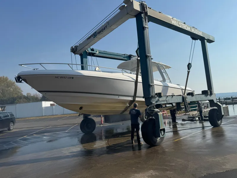 Slide: The Image of 2011 Intrepid 370 Cuddy boat on lift at Walstrom Marine. - 28