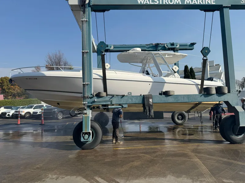 Slide: The Image of 2011 Intrepid 370 Cuddy boat being lifted at Walstrom Marine facility. - 29