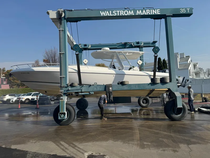 Slide: The Image of 2011 Intrepid 370 Cuddy boat lifted by Walstrom Marine crane. - 30