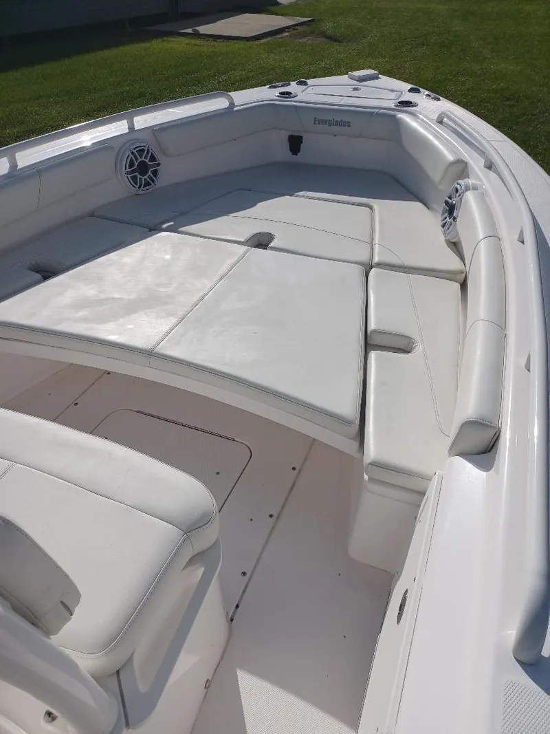 Slide: The Image of 2022 Everglades 243 Center Console boat with spacious seating and sleek design. - 24