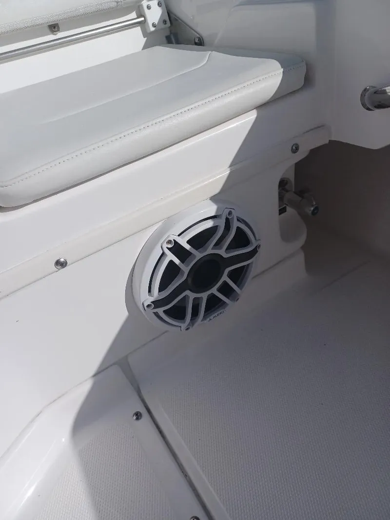 Slide: The Image of 2022 Everglades 243 Center Console boat interior with speaker and seating detail. - 27