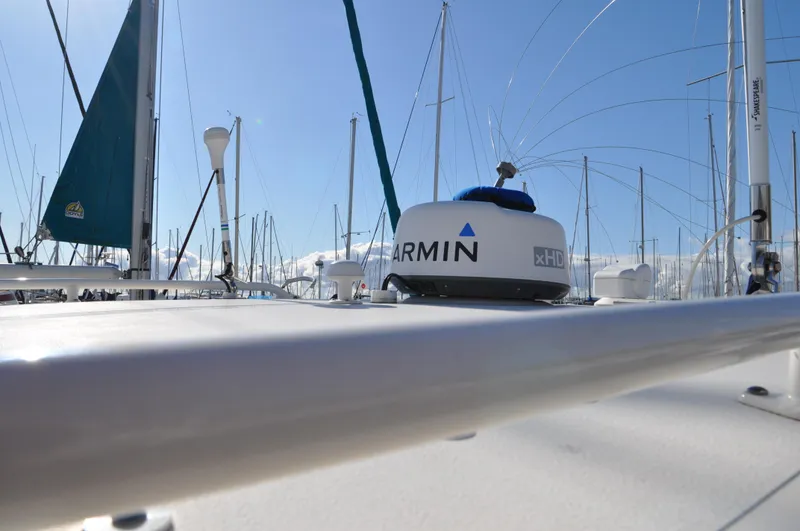Slide: The Image of 2014 Pursuit OS 315 Offshore boat with Garmin radar, docked in a marina. - 30