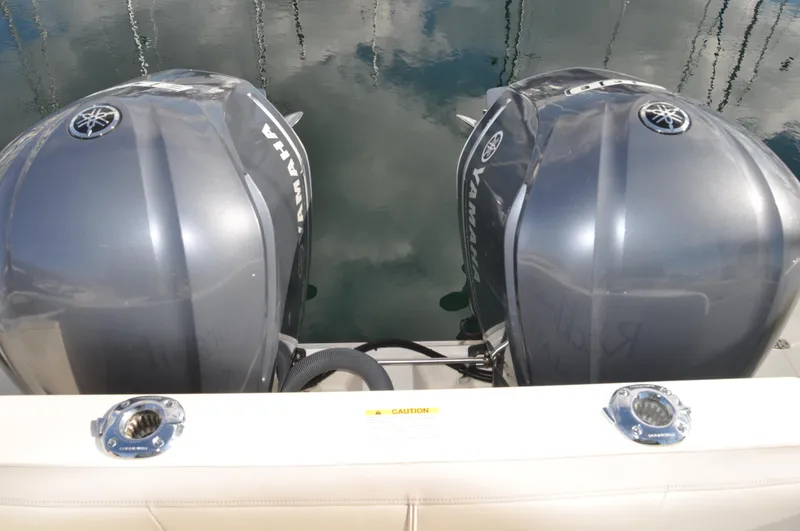 Slide: The Image of Twin Yamaha outboard engines on a 2014 Pursuit OS 315 Offshore boat. - 34