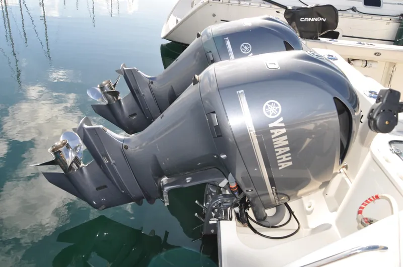 Slide: The Image of Twin Yamaha outboard engines on a 2014 Pursuit OS 315 Offshore boat. - 35